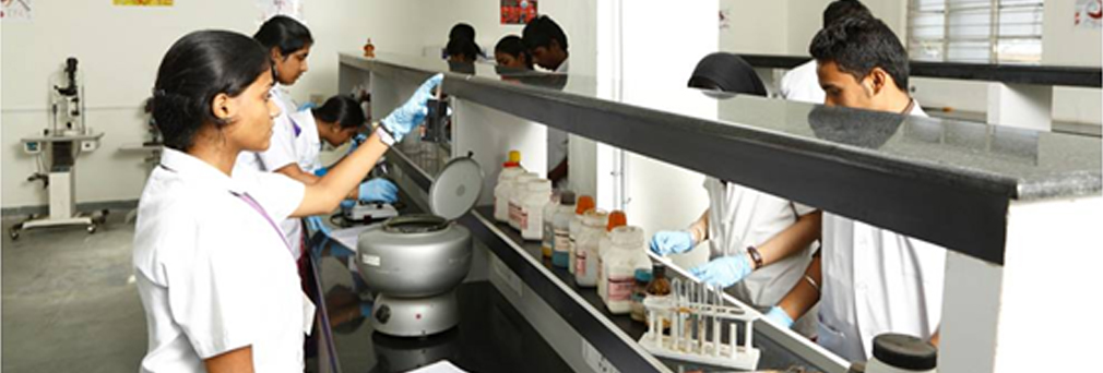 Alpha students using lab equipments in college pathology laboratory