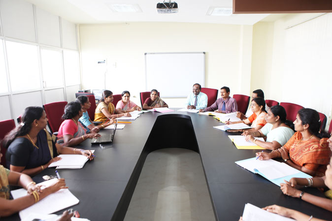 alpha arts chennai Staffs sitting in the conference meeting room