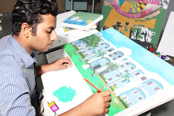 7.	Alpha Arts and Science student drawing a picture of the college
