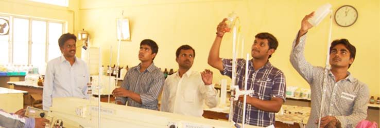 Alpha students using lab equipments in college laboratory