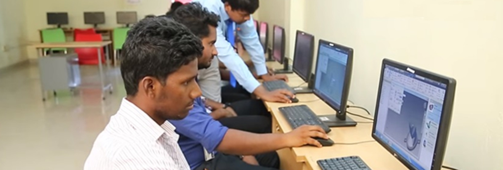 Alpha students using lab equipments in college CAD CAM laboratory