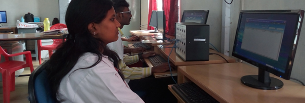 Alpha students using lab equipments in college Computer Networks laboratory