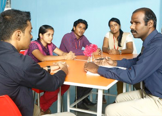 Faculty interacting with students